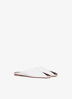 SPIKE FLAT MULES IN CALFSKIN