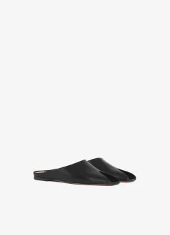 SPIKE FLAT MULES IN CALFSKIN