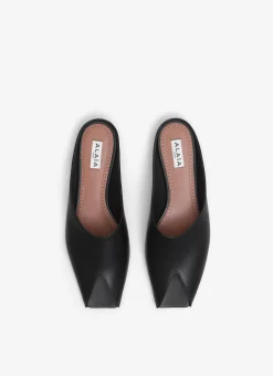 SPIKE FLAT MULES IN CALFSKIN