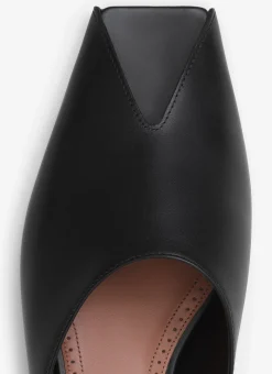 SPIKE FLAT MULES IN CALFSKIN